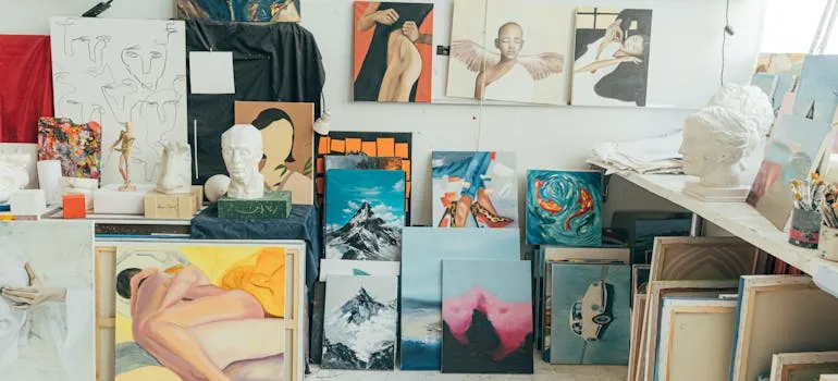 pexels-shkrabaanthony-4442074.jpg Art studio with various paintings, sculptures, and art supplies